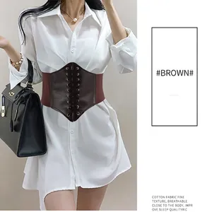 Women's vintage brown corset belt with lace-up front and elastic band on white shirt
