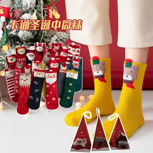 Festive Christmas mid-calf socks with 3D cartoon designs in a red holiday gift box