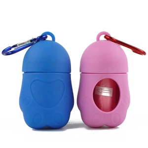 Portable silicone pet waste bag dispenser in cat paw shape with blue and pink color options
