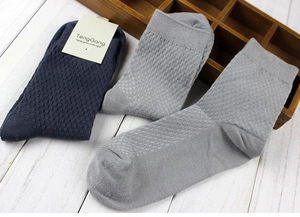 Detail view of charcoal and blue bamboo fiber crew socks with honeycomb waffle texture