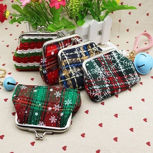 Detail of Christmas vintage fabric coin purses with festive patterns and metal clasps