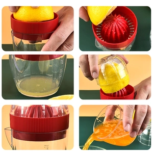 Manual manual citrus juicer set with red squeezer and transparent scaled measuring cup