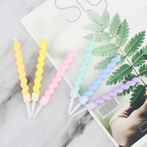 Colorful spiral birthday candles in yellow, pink, green, blue, and purple hues