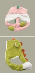 Detail view of plush dinosaur hats with soft fleece ears and colorful spines