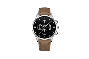 Detail of chronograph dial with three sub-dials and calendar window on leather watch