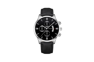 Close-up of black dial men's chronograph watch with silver case and leather strap