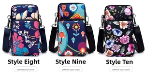 Detail view of floral print crossbody phone bags with dual zippers in multiple patterns