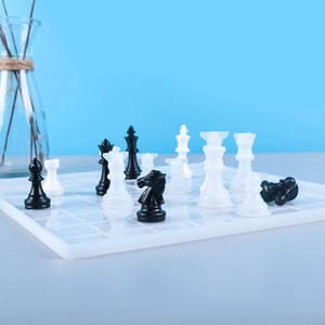 Detailed view of handmade resin chess set with translucent board and matte pieces