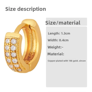 Detail of 18K gold plated huggie earrings with double row cubic zirconia in 1.3cm size
