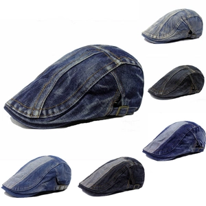 Detail view of denim flat caps in various washes featuring adjustable metal side buckles