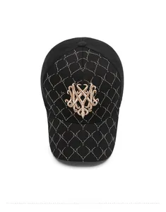 Top view of black baseball cap with golden embroidery and diamond quilted pattern