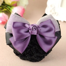 Detailed view of the purple satin ribbon bow hairnet with center rose decoration