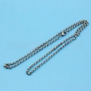 Close-up of silver stainless steel round link chain with secure lobster clasp closure