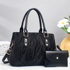 Elegant black large capacity women's tote bag with textured finish and golden buckle