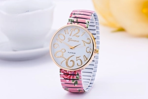 Detail of Geneva floral stretch band watch with golden case and white dial numbers