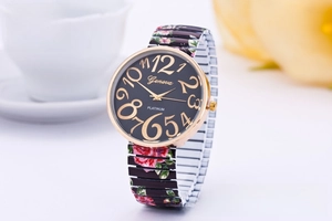 Detail of Geneva stretch watch featuring a floral print band and large gold numerals