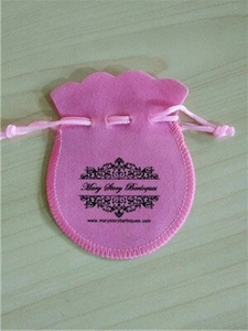 Detail of pink velvet drawstring jewelry pouch with Mary Story Berloques printed logo