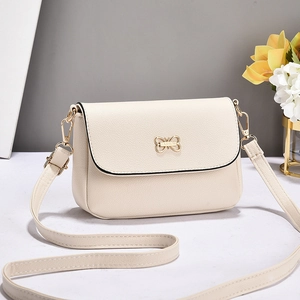 Sac bandoulière élégant blanc crème à motif litchi avec boucle papillon dorée