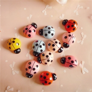 Flatback resin ladybug charms for DIY crafts and hair accessories in assorted colors