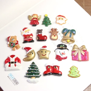 Flat lay of colorful resin Christmas charms with glitter for DIY craft decorations