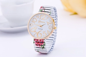 Detail of Geneva quartz watch with floral printed stretch band and gold-tone case
