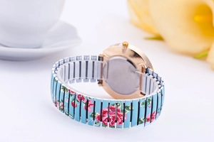 Detailed back view of rose gold floral stretch watch band with pink flower prints