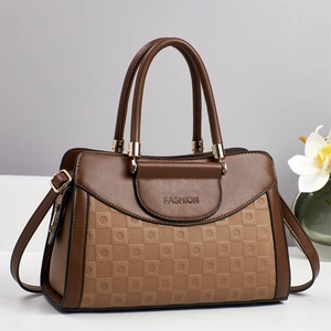 Women's two-tone brown tote bag with quilted texture and golden hardware details