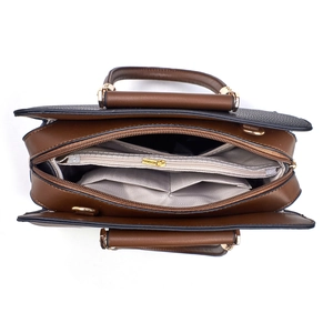 Top view of tote bag interior with multiple compartments and textured synthetic leather