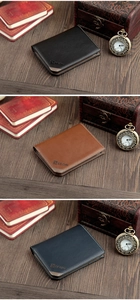 Three men's bifold wallets in black, brown, and blue with lychee grain leather finish