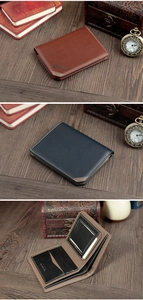 Macro view of a bifold leather wallet with dual contrast stitching and multiple card slots