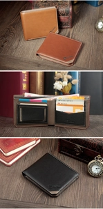 Close-up of three men's bi-fold leather wallets in brown and black on a retro wooden desk