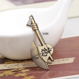 Macro shot of 56mm bronze alloy axe pendant featuring detailed vintage engravings