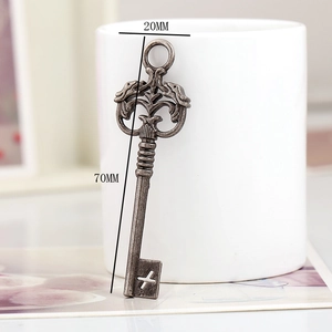 Detail showing vintage bronze key pendant measurements of 20MM width and 70MM length