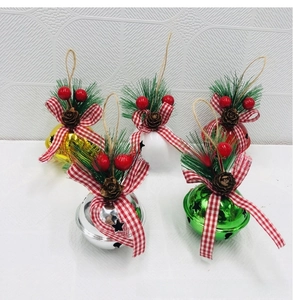 Detail of five colorful Christmas iron bells with festive bows, pine cones and star cutouts