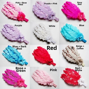 Detail showing 12 colors of feather mesh flower headbands with pearls and elastic bands