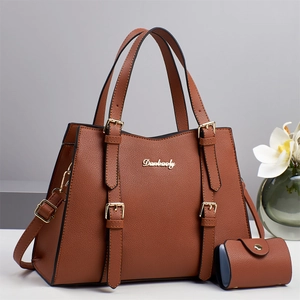 Elegant brown pebble leather Boston tote bag set with golden hardware and shoulder strap