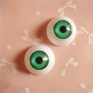 Detail of 20mm green resin doll eyes with white sclera and black pupils for DIY crafts