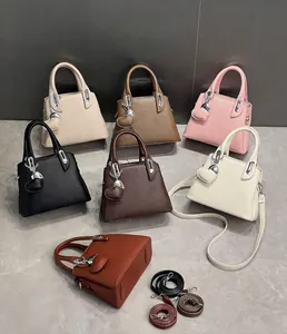 Litchi texture leather handbag detail with silver lock and heart pendant dimensions