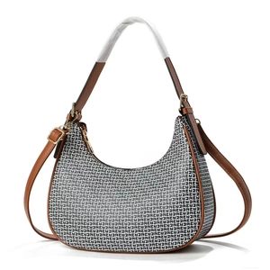 Classic crescent hobo bag with black and white monogram pattern and brown leather straps