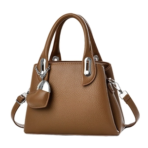 Brown lychee-textured faux leather handbag with silver hardware and heart charm
