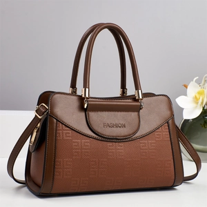 Fashionable brown leather tote bag with dual handles and detachable shoulder strap