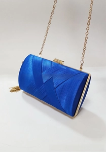 Detail of blue satin evening clutch with woven texture and elegant gold chain tassel