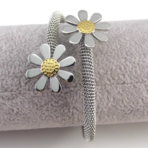 Daisy mesh open bangle in silver and gold-tone stainless steel with floral motif