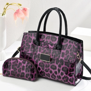 Fashionable purple leopard print handbag set with matching zipper pouch and crossbody strap