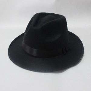 Detailed view of black wool jazz fedora hat featuring a satin ribbon and side knot