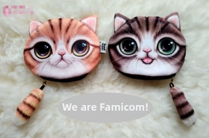 Detail of plush cat head coin purses with realistic orange and grey tabby prints