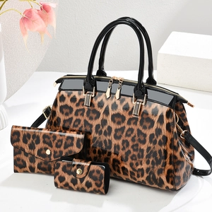 Three-piece set of leopard print shiny leather handbags with tote, wallet and key case