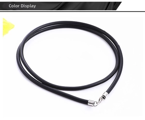 Detail of minimalist black rubber necklace cord with silver lobster clasp closure