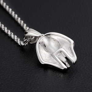 Silver Spartan helmet pendant necklace in stainless steel on black leather texture