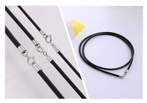 Detail of black rubber necklace cord with silver spring clasp and spiral cord arrangement